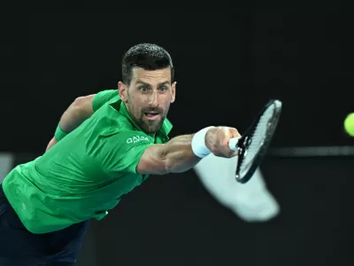 19 January 2026, Australia, Melbourne: Novak Djokovic of Serbia in action during the Men's 1st round match against Pedro Martinez of Spain on day 2 of the 2026 Australian Open tennis tournament at Melbourne Park in Melbourne. Photo: James Ross/AAP/dpa