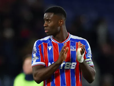 FILE PHOTO: Soccer Football - Premier League - Crystal Palace v Fulham - Selhurst Park, London, Britain - January 1, 2026 Crystal Palace's Marc Guehi applauds fans after the match Action Images via Reuters/Matthew Childs EDITORIAL USE ONLY. NO USE WITH UNAUTHORIZED AUDIO, VIDEO, DATA, FIXTURE LISTS, CLUB/LEAGUE LOGOS OR 'LIVE' SERVICES. ONLINE IN-MATCH USE LIMITED TO 120 IMAGES, NO VIDEO EMULATION. NO USE IN BETTING, GAMES OR SINGLE CLUB/LEAGUE/PLAYER PUBLICATIONS. PLEASE CONTACT YOUR ACCOUNT REPRESENTATIVE FOR FURTHER DETAILS../File Photo