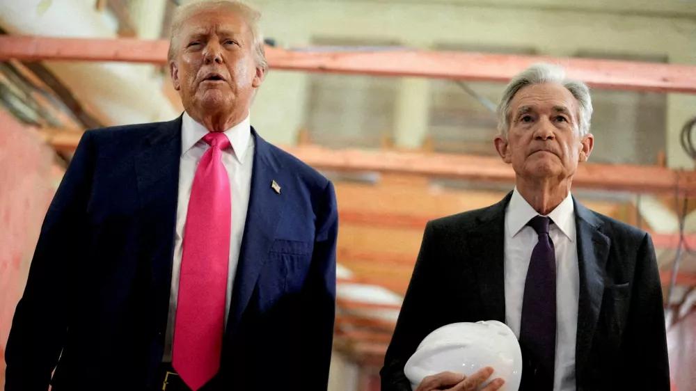 FILE PHOTO: U.S. President Donald Trump and Federal Reserve Chair Jerome Powell speak during a tour of the Federal Reserve Board building, which is currently undergoing renovations, in Washington, D.C., U.S., July 24, 2025. REUTERS/Kent Nishimura/File Photo/File Photo