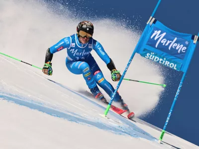 Italy's Federica Brignone speeds down the course during a women's World Cup giant slalom, in Kronplatz, Tuesday, Jan. 20, 2026. (AP Photo/Marco Trovati)