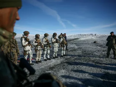FILE PHOTO: Chief of Joint Arctic Command, Major General Soren Andersen speaks to members of the Danish and French armed forces during a military drill as Danish, Swedish, and Norwegian home guard units together with Danish, German and French troops take part in joint military drills in Kangerlussuaq, Greenland, September 17, 2025. REUTERS/Guglielmo Mangiapane/File Photo