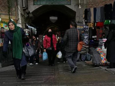 People walk at Tehran's historic Grand Bazaar, Tuesday, Jan. 20, 2026, in Iran. (AP Photo/Vahid Salemi)