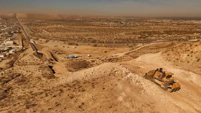 An aerial view shows machinery during the construction of a new section of the border wall at Monte Cristo Rey in Sunland Park, New Mexico, on the U.S.-Mexico border, part of the "Smart Wall" project promoted by U.S. President Donald Trump's administration to combat irregular migration from Mexico into the United States, seen from Ciudad Juarez, Mexico, January 21, 2026. REUTERS/Jose Luis Gonzalez
