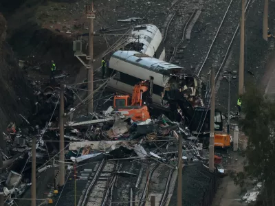 A crane participates in removal works following the deadly derailment of two high-speed trains near Adamuz, in Cordoba, Spain, January 22, 2026. REUTERS/Susana Vera