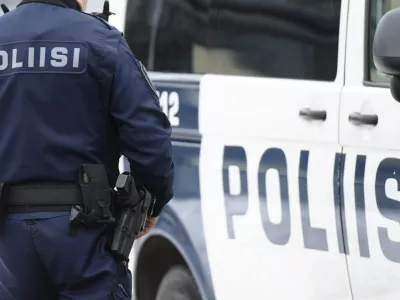 10 March 2016, Finland, Helsinki: A police officer stands next to a vehicle during the Police Local Defense West 1 exercise in Laajasalo. Photo: Vesa Moilanen/Lehtikuva/dpa