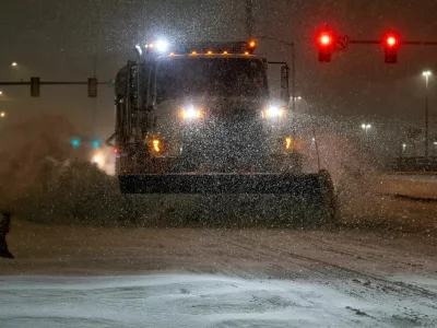 A vehicle equipped with a snowplow clears snow as Winter Storm Fern arrives in Oklahoma City, Oklahoma, U.S., January 23, 2026. REUTERS/Nick Oxford