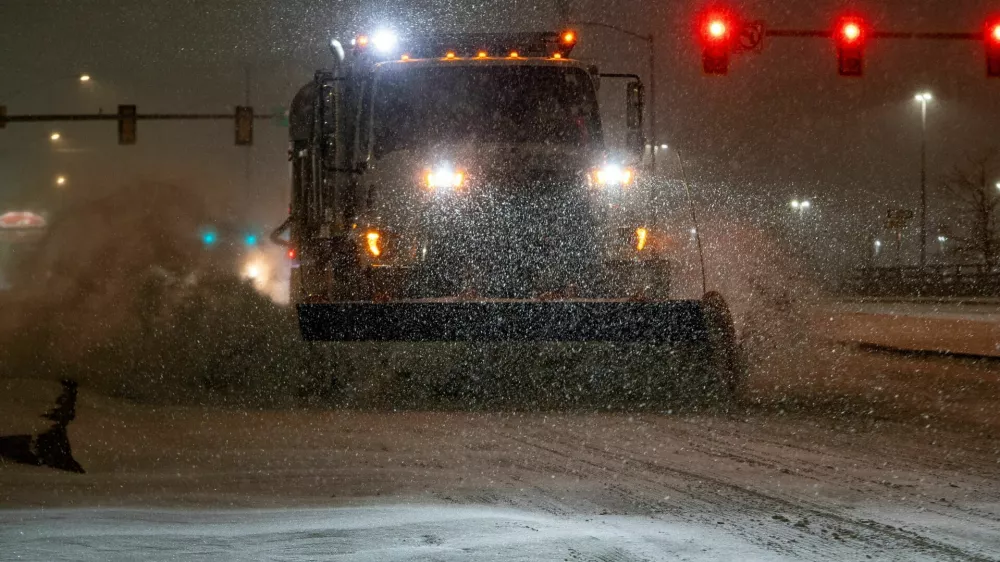 A vehicle equipped with a snowplow clears snow as Winter Storm Fern arrives in Oklahoma City, Oklahoma, U.S., January 23, 2026. REUTERS/Nick Oxford