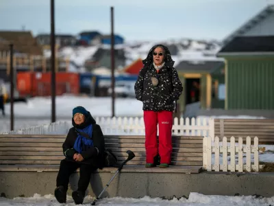 A person stands on a bench in Nuuk, Greenland, January 23, 2026. REUTERS/Marko Djurica