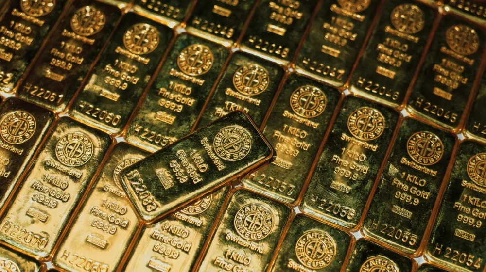 File photo dated March 13, 2001 of Gold bars in Switzerland. Gold prices have soared to a record high, with investors rushing to find safe places to park their money as concerns grow about a resurgence in the coronavirus and the impact that could have on the global economy.,Image: 548000153, License: Rights-managed, Restrictions:, Model Release: no