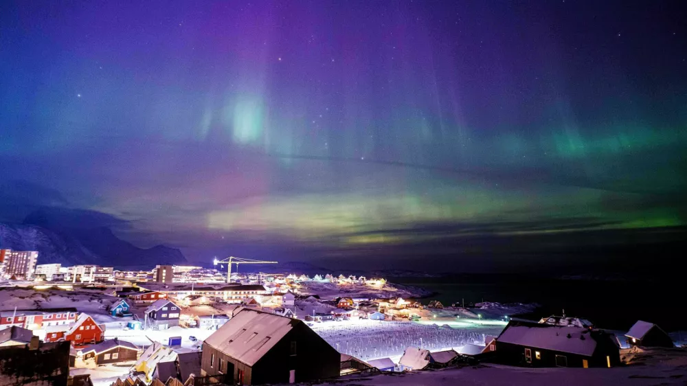 FILE - Aurora borealis, also known as the northern lights, is seen in the sky above Nuuk, Greenland, Tuesday, Jan. 20, 2026. (AP Photo/Evgeniy Maloletka, File)