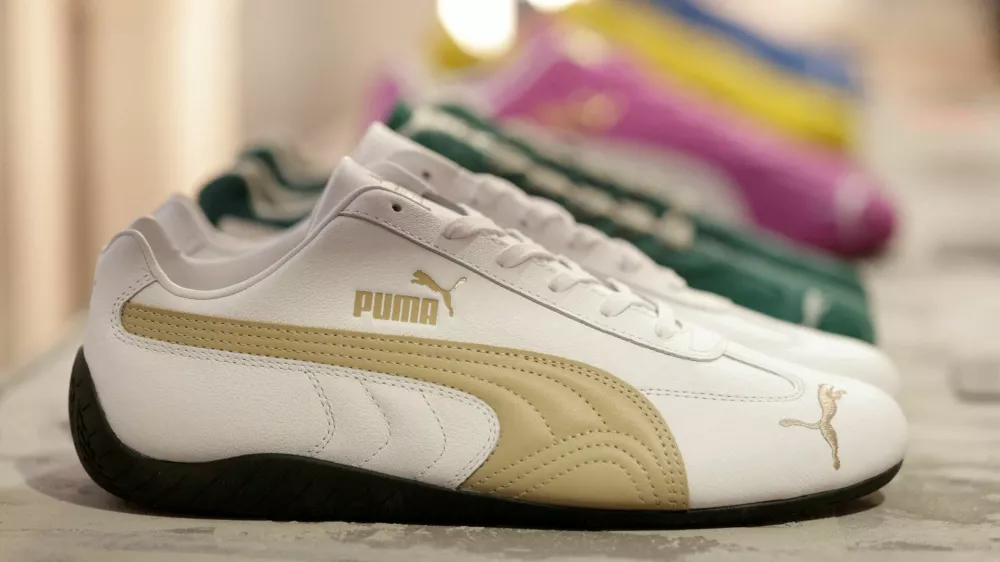 FILE PHOTO: Puma Speedcat OG sneakers are displayed at the Puma Mostro House in Paris, France, January 24, 2025. REUTERS/Abdul Saboor/File Photo
