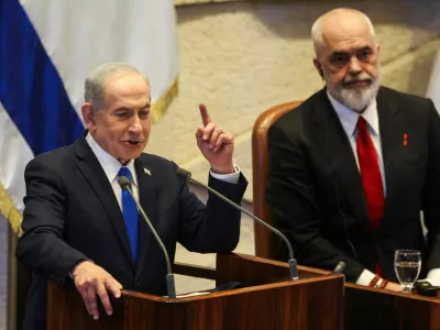 Israeli Prime Minister Benjamin Netanyahu speaks at the plenum of the Knesset, next to Albania's Prime Minister Edi Rama, in Jerusalem, January 26, 2026. REUTERS/Ronen Zvulun