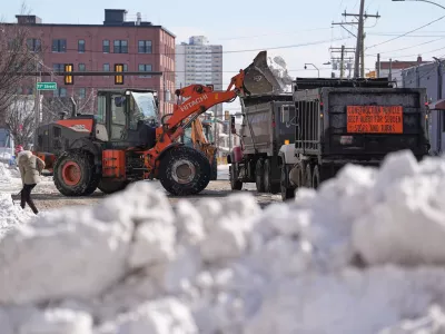 Snow is removed in the aftermath of a winter storm in Philadelphia, Monday, Jan. 26, 2026. (AP Photo/Matt Rourke)
