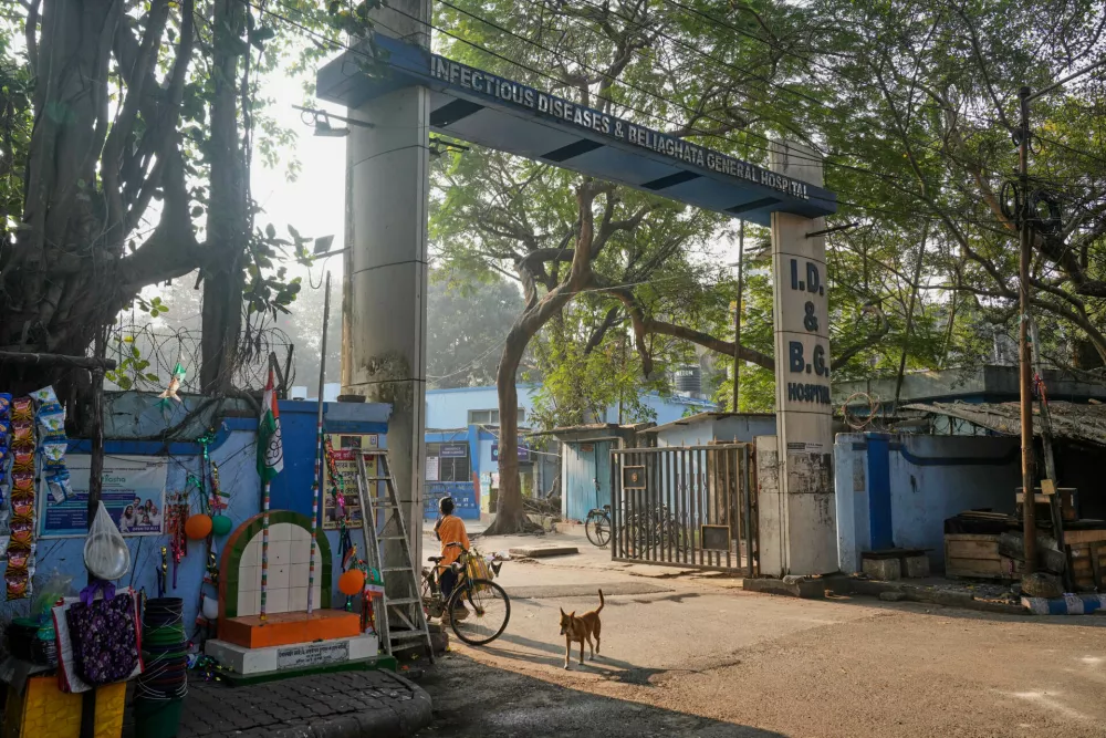 A stray dog roams at the entrance of the Infectious Diseases and Beliaghata General Hospital, in Kolkata, India, Wednesday, Jan. 28, 2026. (AP Photo/Bikas Das)