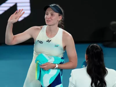 Elena Rybakina of Kazakhstan waves after winning her semifinal match against Jessica Pegula of the U.S. at the Australian Open tennis championship in Melbourne, Australia, Thursday, Jan. 29, 2026. (AP Photo/Dar Yasin)