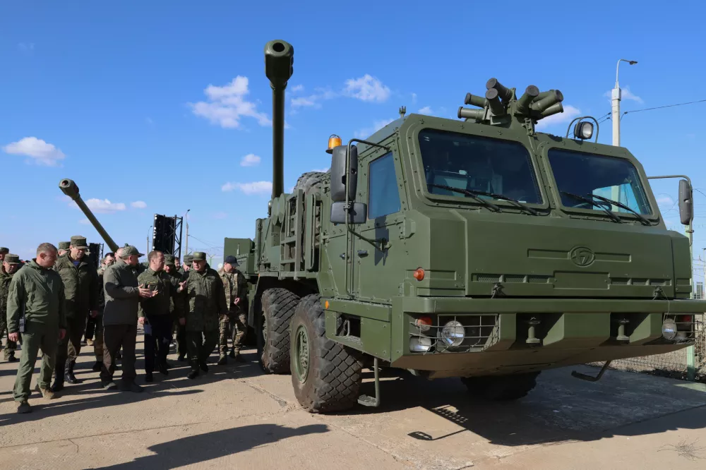 Russian Security Council Deputy Chairman and the head of the United Russia party Dmitry Medvedev looks at advanced weapons during his visit to the Kapustin Yar test range in Astrakhan region, Russia, Saturday, Oct. 18, 2025. (Ekaterina Shtukina, Sputnik, Pool Photo via AP)
