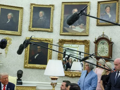 FILE PHOTO: U.S. Vice President JD Vance, U.S. White House Chief of Staff Susie Wiles, and U.S. White House deputy chief of staff Stephen Miller listen as U.S. President Donald Trump speaks during a meeting with Canadian Prime Minister Mark Carney (not pictured) in the Oval Office at the White House in Washington, D.C., U.S., May 6, 2025. REUTERS/Leah Millis/File Photo