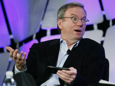 Google Executive Chairman Eric Schmidt, holding a cell phone running Google software speaks on a panel discussing "The Next Big Thing" on the opening day of the Consumer Electronics Show in Las Vegas January 10, 2012.  REUTERS/Rick Wilking (UNITED STATES - Tags: BUSINESS SCIENCE TECHNOLOGY)