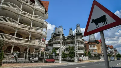 Palaces belonging to Romanian Roma people are pictured in Buzescu village, southern Romania, on July 11, 2019. In Romania's fields or on the outskirts of villages, the "Roma palaces" -- their imposing facades shining with ornaments -- stand in stark contrast to their modest surroundings, revealing their owners' quests for status within a marginalised minority.,Image: 461203988, License: Rights-managed, Restrictions: TO GO WITH AFP STORY by Ionut IORDACHESCU, Mihaela RODINA, Model Release: no