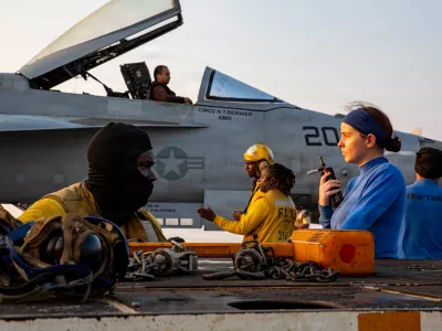 This handout photograph from the U.S. Navy shows sailors taxiing an F/A-18E Super Hornet on the flight deck of the Nimitz-class aircraft carrier USS Abraham Lincoln in the Indian Ocean on Jan. 25, 2026. (Mass Communication Specialist 3rd Class Shepard Fosdyke-Jackson/U.S. Navy via AP)
