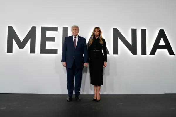 President Donald Trump and first lady Melania Trump arrive for the premiere of her movie "Melania" at The John F. Kennedy Memorial Center For The Performing Arts, Thursday, Jan. 29, 2026, in Washington. (AP Photo/Jose Luis Magana)