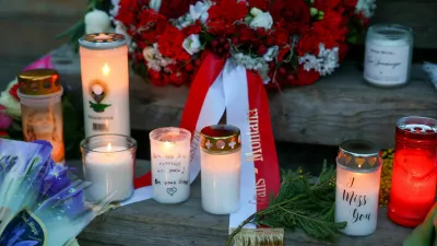 FILE PHOTO: Candles burn at a makeshift memorial outside the "Le Constellation bar" almost a month after a deadly fire during a New Year's Eve party, in the upscale ski resort of Crans-Montana, Switzerland, January 31, 2026. REUTERS/Denis Balibouse/File Photo