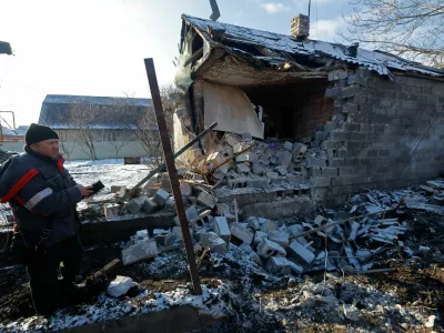 Konstantin (no last name given) inspects his house, which was destroyed during what Russian-installed authorities called a recent Ukrainian drone attack, in the course of Russia-Ukraine conflict in the settlement of Sartana in the Donetsk region, a Russian-controlled area of Ukraine, February 1, 2026. REUTERS/Alexander Ermochenko