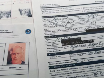 A document that was included in the U.S. Department of Justice release of the Jeffrey Epstein files is photographed Sunday, Feb. 1, 2026, shows the report when Epstein was taken into custody on July 6, 2019. (AP Photo/Jon Elswick)