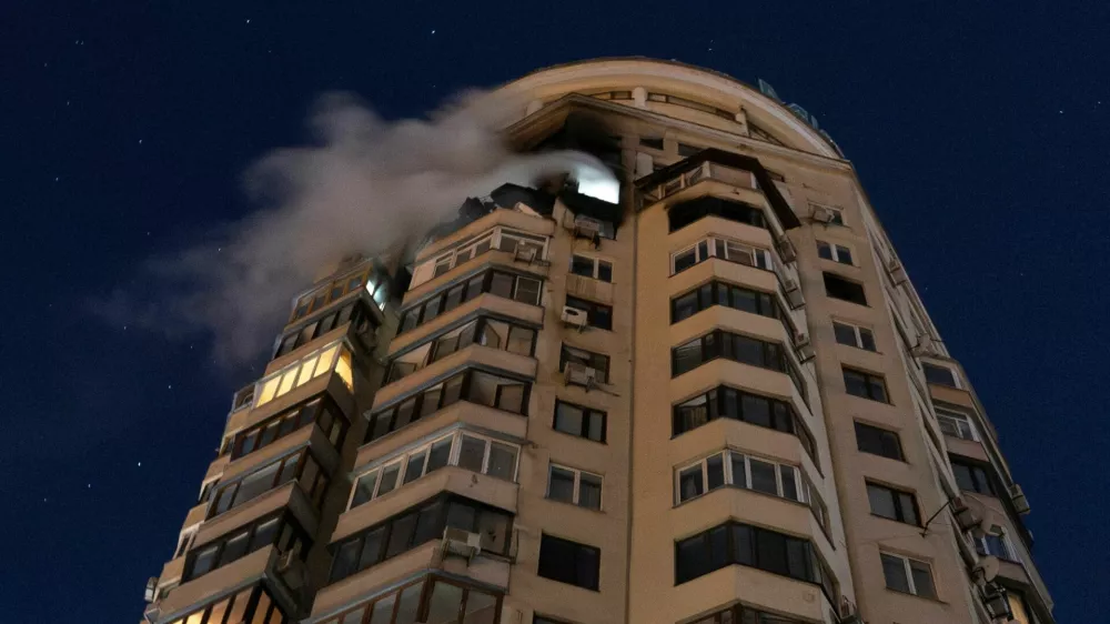 Smoke billows from an apartment building after it was struck by a drone during Russian missile and drone attacks, in Kyiv, Ukraine, February 3, 2026. REUTERS/Thomas Peter