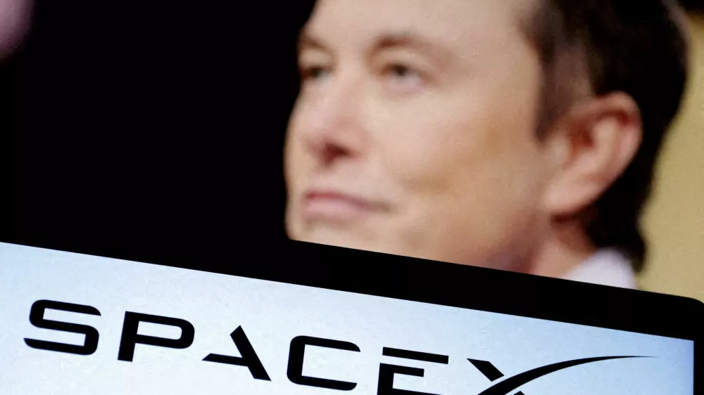 FILE PHOTO: SpaceX's logo and an Elon Musk photo are seen in this illustration created on December 19, 2022. REUTERS/Dado Ruvic/Illustration/File Photo