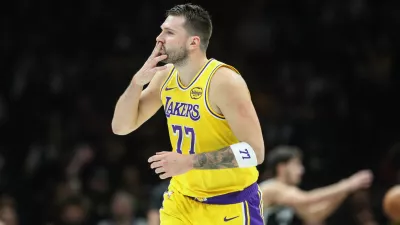 Feb 3, 2026; Brooklyn, New York, USA; Los Angeles Lakers guard Luka Doncic (77) gestures after scoring in the first quarter against the Brooklyn Nets at Barclays Center. Mandatory Credit: Wendell Cruz-Imagn Images