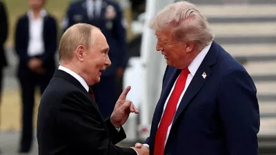FILE PHOTO: U.S. President Donald Trump shakes hand with Russian President Vladimir Putin, as they meet to negotiate for an end to the war in Ukraine, at Joint Base Elmendorf-Richardson in Anchorage, Alaska, U.S., August 15, 2025. REUTERS/Kevin Lamarque/File Photo