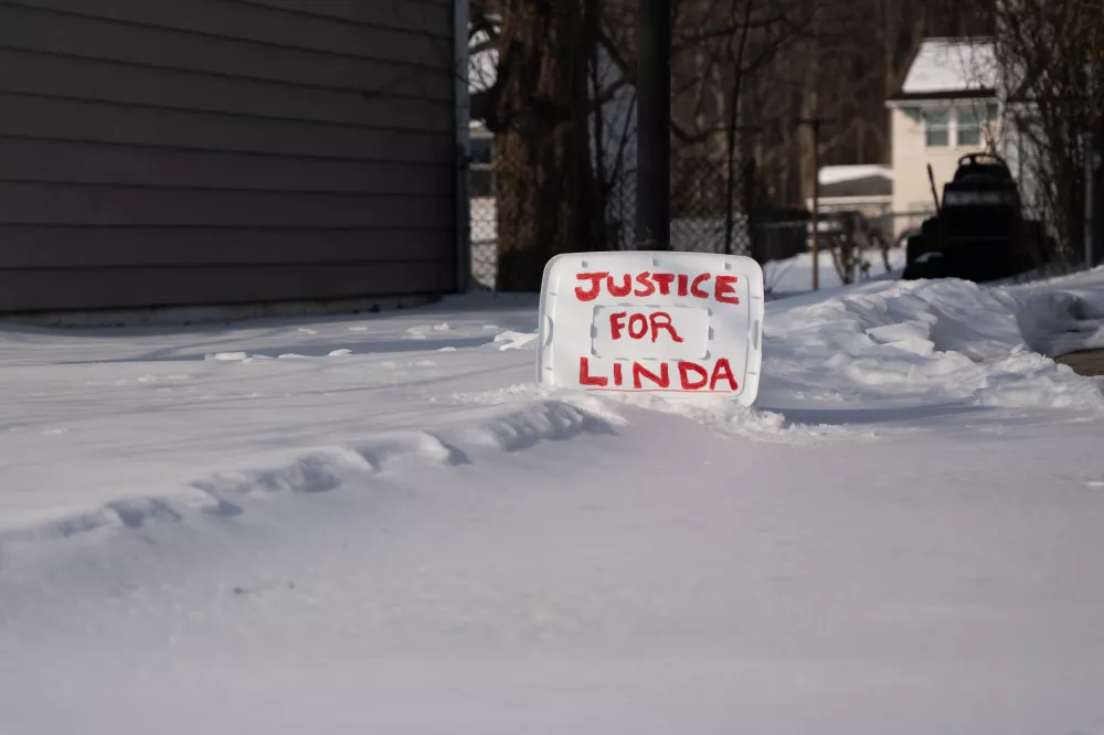 A sign reading "Justice for Linda" is seen in a yard near the home of William Stevenson, the ex-husband of former first lady Jill Biden, in Wilmington, Del., Tuesday, Feb. 3, 2026. (AP Photo/Mingson Lau)