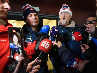 08 March 2025, Norway, Trondheim: Norway ski jumping team coach Magnus Brevig (L) and sports director Jan-Erik Aalbu answer questions from the press in Granasen after two Norwegian jumpers were disqualified and accused of cheating after the men's large hill competition at the World Ski Championships in Trondheim. Photo: Terje Pedersen/NTB/dpa