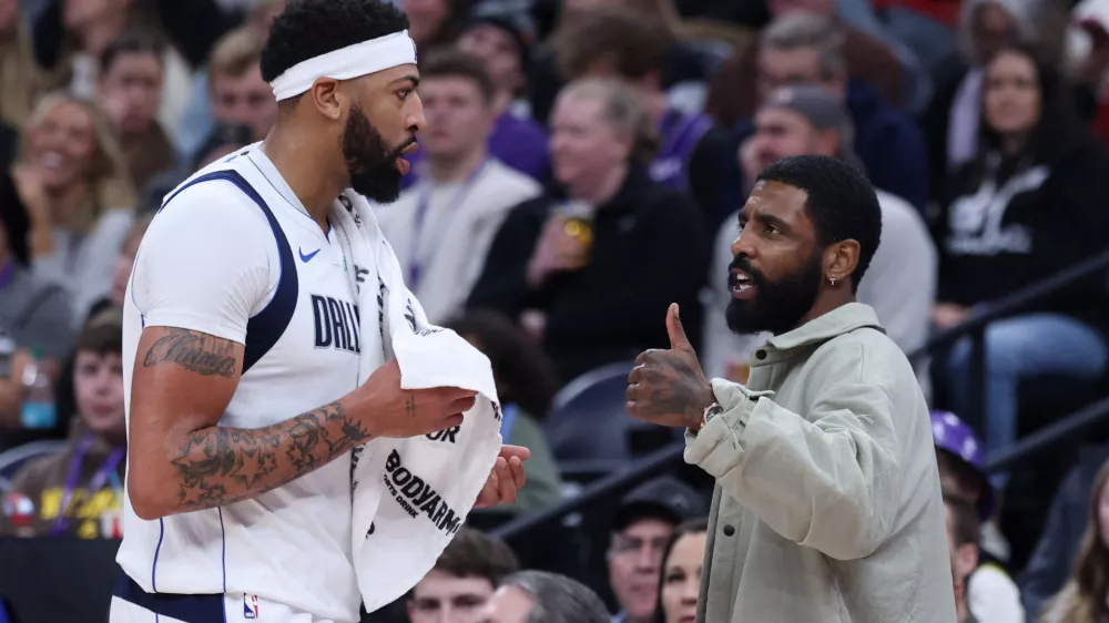 Jan 8, 2026; Salt Lake City, Utah, USA; Dallas Mavericks forward Anthony Davis (l3) and guard Kyrie Irving (right) speak during a second half break in action against the Utah Jazz at Delta Center. Mandatory Credit: Rob Gray-Imagn Images