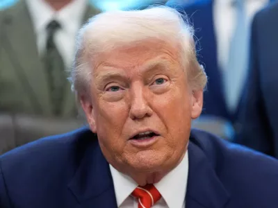 President Donald Trump speaks to reporters after signing a spending bill that ends a partial shutdown of the federal government in the Oval Office of the White House, Tuesday, Feb. 3, 2026, in Washington. (AP Photo/Alex Brandon)