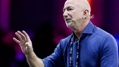 Amazon founder Jeff Bezos gestures as he speaks at the main panel of Italian Tech Week 2025 in Turin, Italy October 3, 2025. REUTERS/Remo Casilli