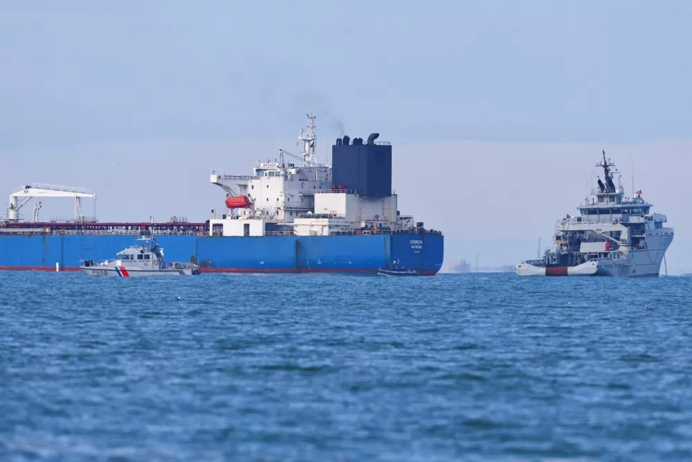 French navy boats surround the GRINCH oil tanker, intercepted by France in the Alboran Sea on suspicion of operating under a false flag and belonging to Russia's shadow fleet that enables Russia to export oil despite sanctions, and diverted to the port of Marseille-Fos, in the Gulf of Fos-sur-Mer, in Martigues, France, January 25, 2026. REUTERS/Manon Cruz