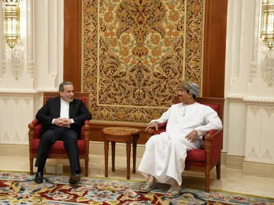 Iran's Foreign Minister Abbas Araghchi is welcomed by an Omani official upon his arrival in Muscat, Oman, in this handout image obtained on February 6, 2026. Iranian Foreign Ministry/WANA (West Asia News Agency)/Handout via REUTERS ATTENTION EDITORS - THIS PICTURE WAS PROVIDED BY A THIRD PARTY