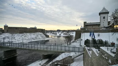 The Narva Castle (R) and the Ivangorod Fortress (L) are pictured and the border bridge across the Narva River in Narva, on January 15, 2026. Two medieval fortresses face each other across the Narva River separating Estonia from Russia on Europe's eastern edge. Once a symbol of cooperation, the "Friendship Bridge" connecting the two snow-covered banks has been reinforced with rows of razor wire and "dragon's teeth" anti-tank obstacles on the Estonian side.,Image: 1072434686, License: Rights-managed, Restrictions: TO GO WITH AFP STORY by Anna SMOLCHENKO, Model Release: no