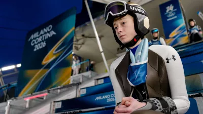 Nika Prevc, of Slovenia, waits her turn to jump during a ski jumping, women's normal hill, training session, at the 2026 Winter Olympics, in Predazzo, Italy, Thursday, Feb. 5, 2026. (AP Photo/Matthias Schrader)