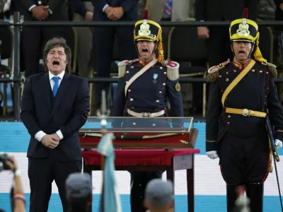 Argentina's President Javier Milei stands in front of the curved sabre that belonged to Argentina's independence leader General Jose de San Martin, during a ceremony to present it to the San Lorenzo regiment, in San Lorenzo, Santa Fe, Argentina, February 7, 2026. REUTERS/Francisco Loureiro   TPX IMAGES OF THE DAY