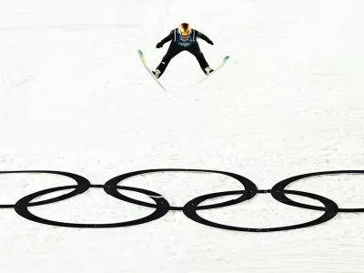 07 February 2026, Italy, Predazzo: Germany's Agnes Reisch flies over the Olympic rings during the Women's 1st round of the Nordic skiing/ski jumping normal hill, as part of the 2026 Winter Olympic games. Photo: Daniel Karmann/dpa