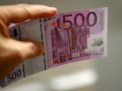 An employee holds a 500 euro banknote in the Money Service Austria company's headquarters in Vienna, Austria, March 3, 2016. REUTERS/Leonhard Foeger/File Photo