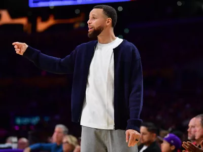 Feb 7, 2026; Los Angeles, California, USA; Golden State Warriors guard Stephen Curry (30) watches game action during the second half at Crypto.com Arena. Mandatory Credit: Gary A. Vasquez-Imagn Images