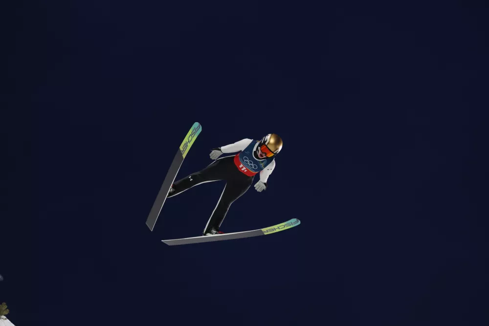 Italija, Predazzo.Zimske olimpijske igre 2026.Smucarski skoki, mesane ekipe, poskusna serija.Slovenska skakalka Nika Vodan.