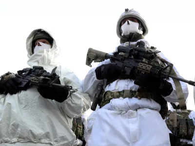 FILE PHOTO: Dutch Marines stand in front of a jet, during the visit of NATO Secretary General Jens Stoltenberg at a base, as part of a military exercise called "Cold Response 2022", gathering around 30,000 troops from NATO member countries plus Finland and Sweden, amid Russia's invasion of Ukraine, in Bardufoss in the Arctic Circle, Norway, March 25, 2022. REUTERS/Yves Herman/File Photo