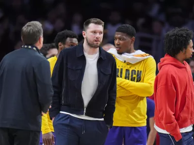 Los Angeles Lakers guard Luka Doncic stands on the court during timeout in an NBA basketball game against the Oklahoma City Thunder Monday, Feb. 9, 2026, in Los Angeles. (AP Photo/Jae C. Hong)