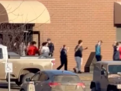 This grab from video shows students exiting the Tumbler Ridge school after deadly shootings, in British Columbia, Canada, Tuesday Feb. 10, 2026. (Jordon Kosik via AP)