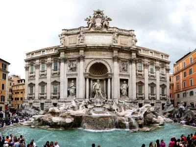 "Rome, Italy - June 2, 2010: Tourist in Rome are visiting and wishing in Fontana Di Trevi, a famous place in Rome."